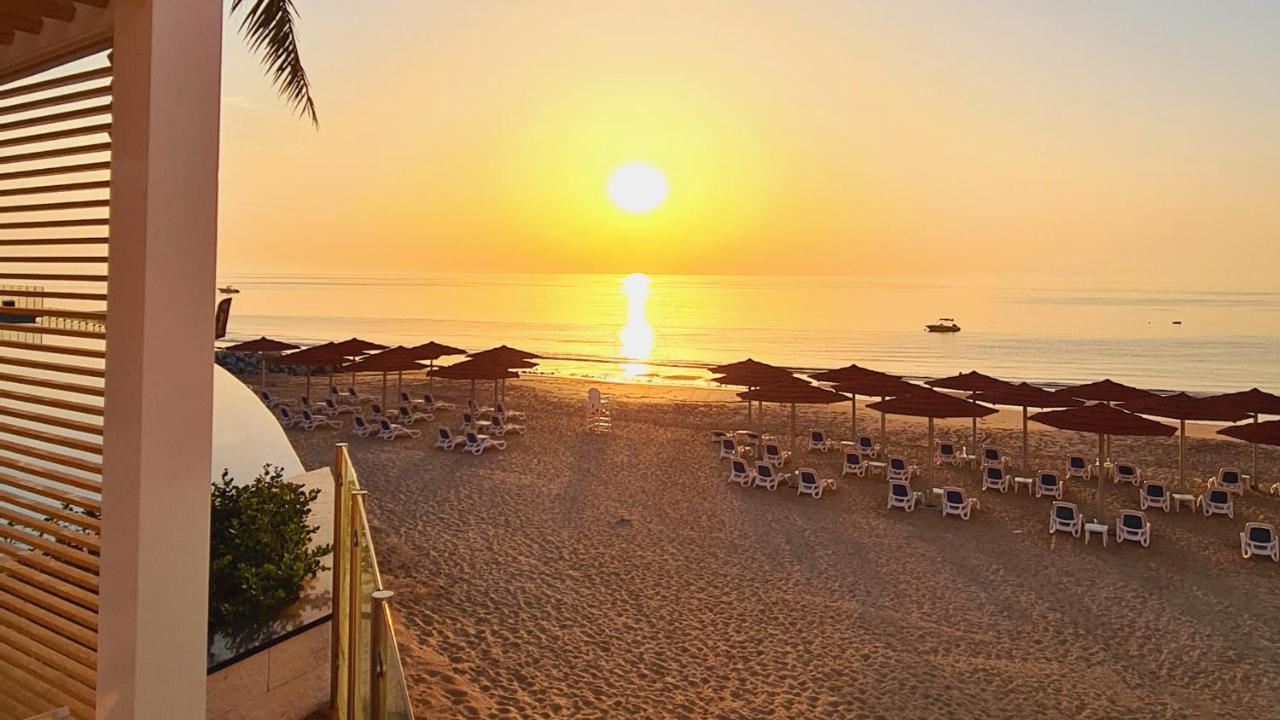 Royal M Al Aqah Beach Resort By Gewan Экстерьер фото Sunset at the beach